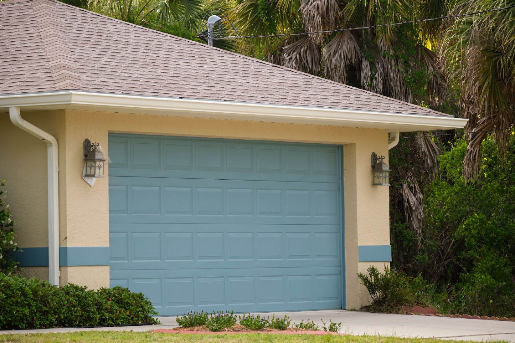 wide-garage-double-door-and-concrete-driveway